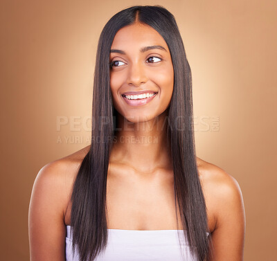 Buy stock photo Texture, hair and skincare with face of woman in studio for keratin, salon treatment and beauty. Shampoo, health and growth with Indian model on brown background for glamour, shine and hairstyle