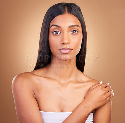 Buy stock photo Portrait, hair care and woman with dermatology, skincare and volume on a brown studio background. Face, person and model with natural beauty, aesthetic and glow with healthy skin, texture and shine