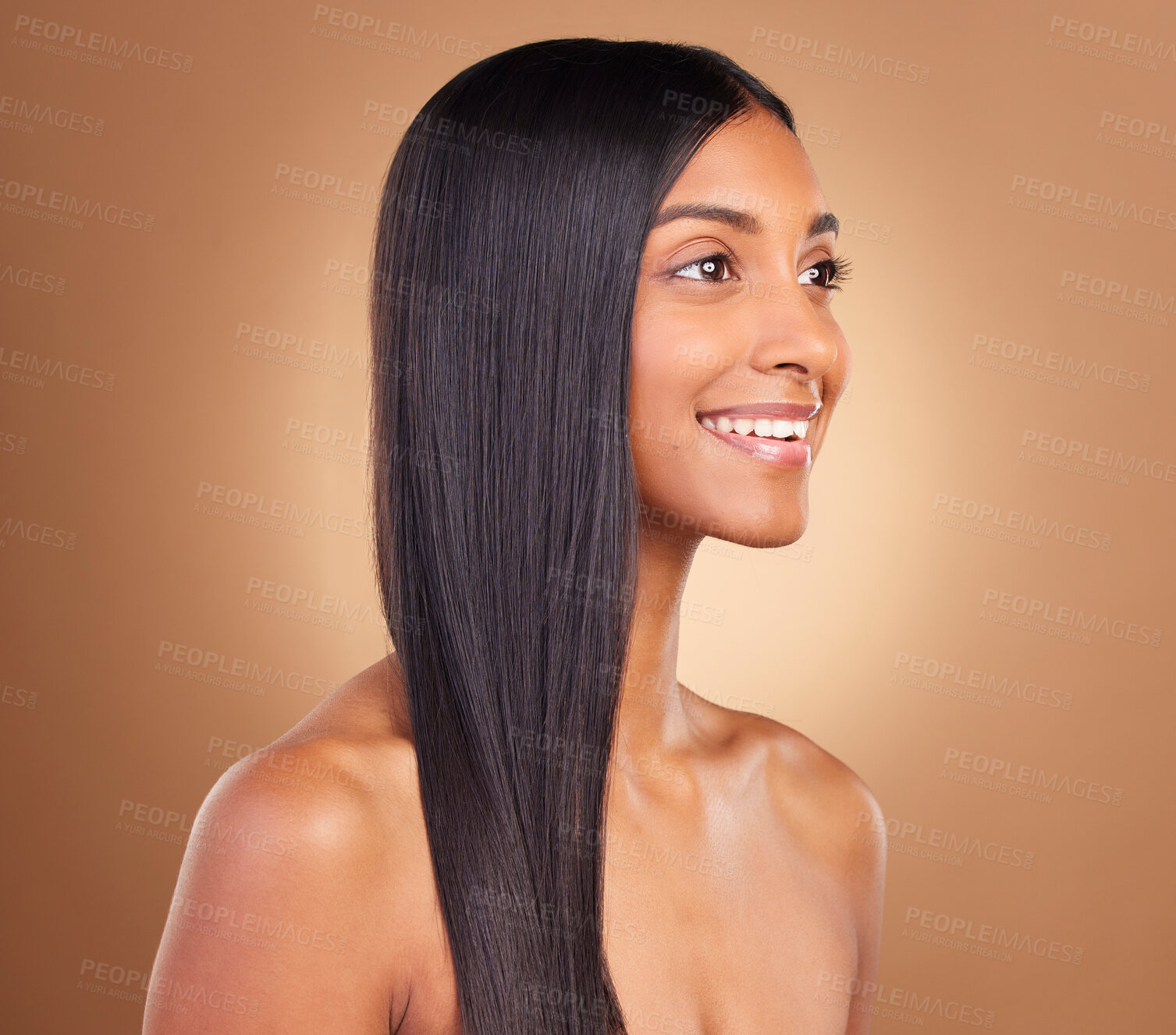 Buy stock photo Smile, hair and skincare with face of woman in studio for keratin, salon treatment and texture. Shampoo, health and vision with Indian model on brown background for glamour, shine and hairstyle