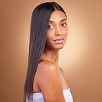 Beauty, hair and skincare with portrait of woman in studio for keratin, salon treatment and texture. Shampoo, health and growth with face of model on brown background for glamour, shine and hairstyle