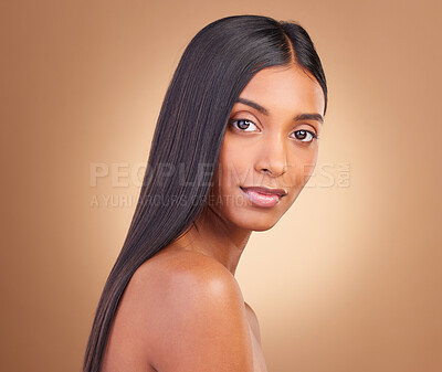 Buy stock photo Portrait, hair care and woman with cosmetics, natural beauty and wellness on a brown studio background. Face, person and model with shine, aesthetic and glow with dermatology, texture and volume