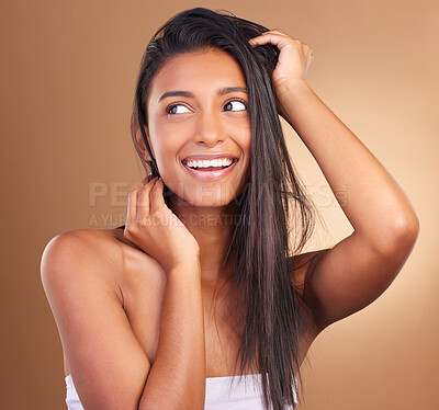 Buy stock photo Beauty, smile and woman in studio for hair, growth or texture and shine against a brown background space. Haircare, cosmetics and face of female model happy for shampoo, mask or volume and results 