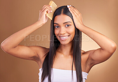 Buy stock photo Beauty, portrait and woman with hair comb in studio for growth, texture or shine on brown background space. Haircare, cosmetics and female wellness model with combing, tool or hairstyle satisfaction
