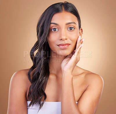 Buy stock photo Portrait, hair care and woman with cosmetics, beauty and natural cosmetics on a brown studio background. Face, person and model with shine, stylish and aesthetic with dermatology, shampoo and luxury