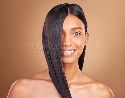 Buy stock photo Portrait, hair care and woman with beauty, shine or dermatology on a brown studio background. Face, person or model with aesthetic, grooming or glow with healthy skin, texture or volume with wellness