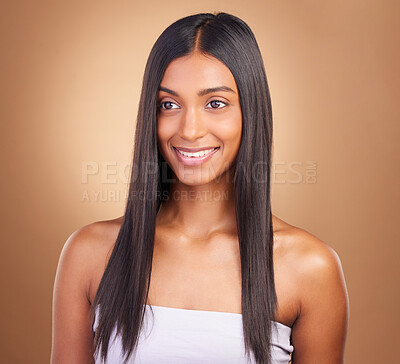 Buy stock photo Beauty, hair care and smile with face of woman in studio for keratin, salon treatment and texture. Shampoo, health and growth with indian model on brown background for glamour, shine and hairstyle