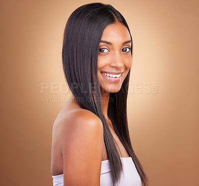 Buy stock photo Portrait, hair care and woman with glow, shine and texture with volume on a brown studio background. Face, person or model with cosmetics, aesthetic or dermatology with healthy skin or natural beauty