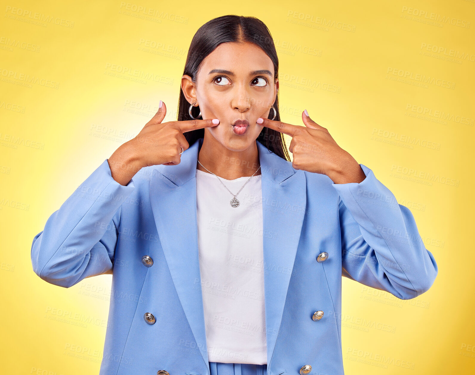 Buy stock photo Face, fingers on cheek and a woman in studio for positive attitude, dimples and emoji. Indian model person or student thinking of fashion, comic and funny face or silly mood on a yellow background