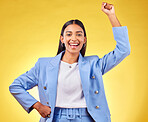 Fist, success and portrait of business woman in studio for pride, professional and champion. Empowerment, power and strong with person on yellow background for celebration, achievement and winner