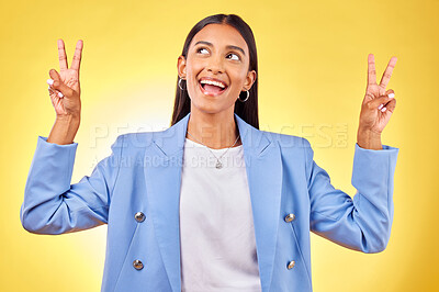 Buy stock photo Fashion, peace sign and Indian woman on yellow background with smile, positive attitude and happy. Emoji, business and person in studio for hand gesture in trendy clothes, professional style and suit