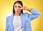 Business woman, peace sign and studio portrait with funny face, pouting and emoji by yellow background. Entrepreneur, hand and eye with kiss, comic face and icon for vote, opinion or crazy gesture