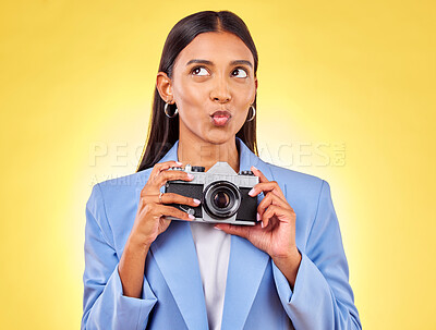 Buy stock photo Pouting, thinking and a woman with a camera on a yellow background for a photography idea. Happy, photographer or a person with gear for paparazzi, press or a journalist employee for pictures