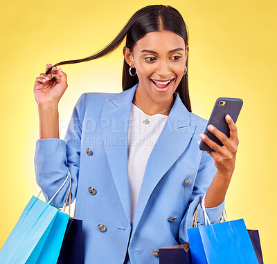 Buy stock photo Shopping, phone and woman with surprise as customer happy for retail fashion isolated in studio yellow background. Shocked, online and young person with discount, deal and promo on clothes or product