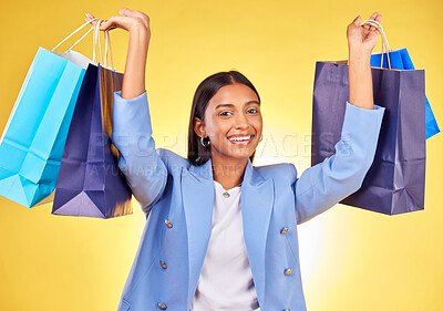 Buy stock photo Excited business woman, shopping bag and studio portrait with smile, success and deal by yellow background. Happy customer experience, gift and discount with retail therapy, sale and fashion choice