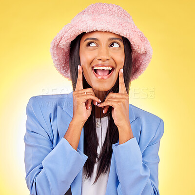 Buy stock photo Fashion, thinking and face of woman on yellow background with funny, goofy and playful expression. Emoji, happiness and happy person in studio smile h in trendy clothes, style and outfit with hat