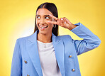Peace sign, happy and woman with a smile and business fashion with emoji hand sign in studio. Yellow background, female person and v gesture with freedom, trendy style and worker with confidence
