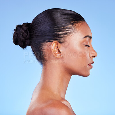 Buy stock photo Woman, skincare and profile of natural beauty or shine on skin from cosmetics on blue background in studio with calm model. Dermatology, facial and healthy glow from makeup, wellness or self care