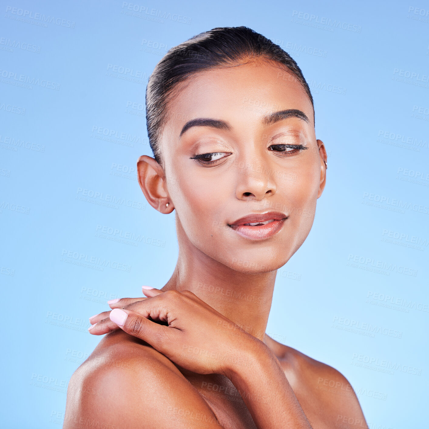 Buy stock photo Beauty, glow and skincare with face of woman in studio for cosmetics, dermatology and facial. Health, self care and wellness with person on blue background for spa treatment, grooming and makeup