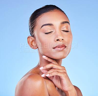 Buy stock photo Beauty, cosmetics and skincare with face of woman in studio for health, dermatology and facial. Glow, self care and wellness with person on blue background for spa treatment, grooming and makeup