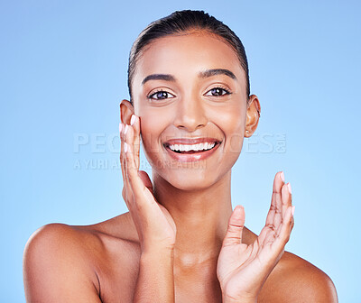 Buy stock photo Cosmetics, smile and skincare with portrait of woman in studio for beauty, dermatology and facial. Glow, self care and wellness with person on blue background for spa treatment, grooming and makeup