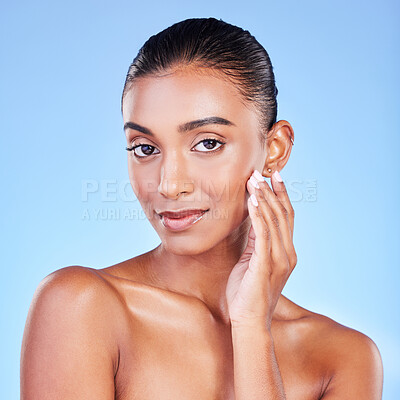 Buy stock photo Woman, natural beauty and portrait with skincare, face cleaning and skin glow in studio. Facial, female model and cosmetics with dermatology, self care and collagen treatment with blue background