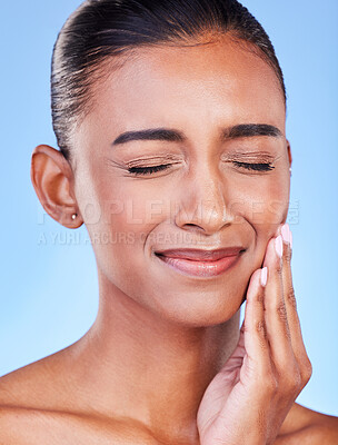 Toothache, sad and a woman with mouth pain on a blue background with a dental emergency. Dentist, frustrated and a girl with a problem with a teeth injury, gingivitis or inflammation of a gum
