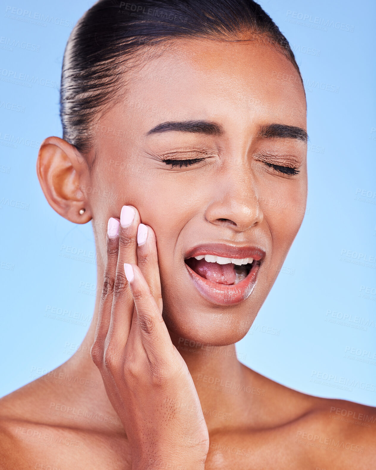 Buy stock photo Toothache, cavity and a woman with mouth pain on a blue background with a dental emergency. Sad, accident and a girl with problem with a teeth injury, gingivitis or inflammation of a gum