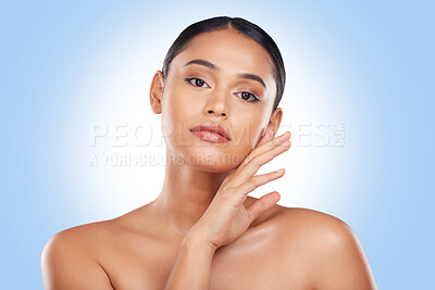 Buy stock photo Beauty, makeup and portrait with face of woman in studio for cosmetics, glow and self care. Health, skincare and dermatology treatment with person on blue background for facial, salon and cosmetology