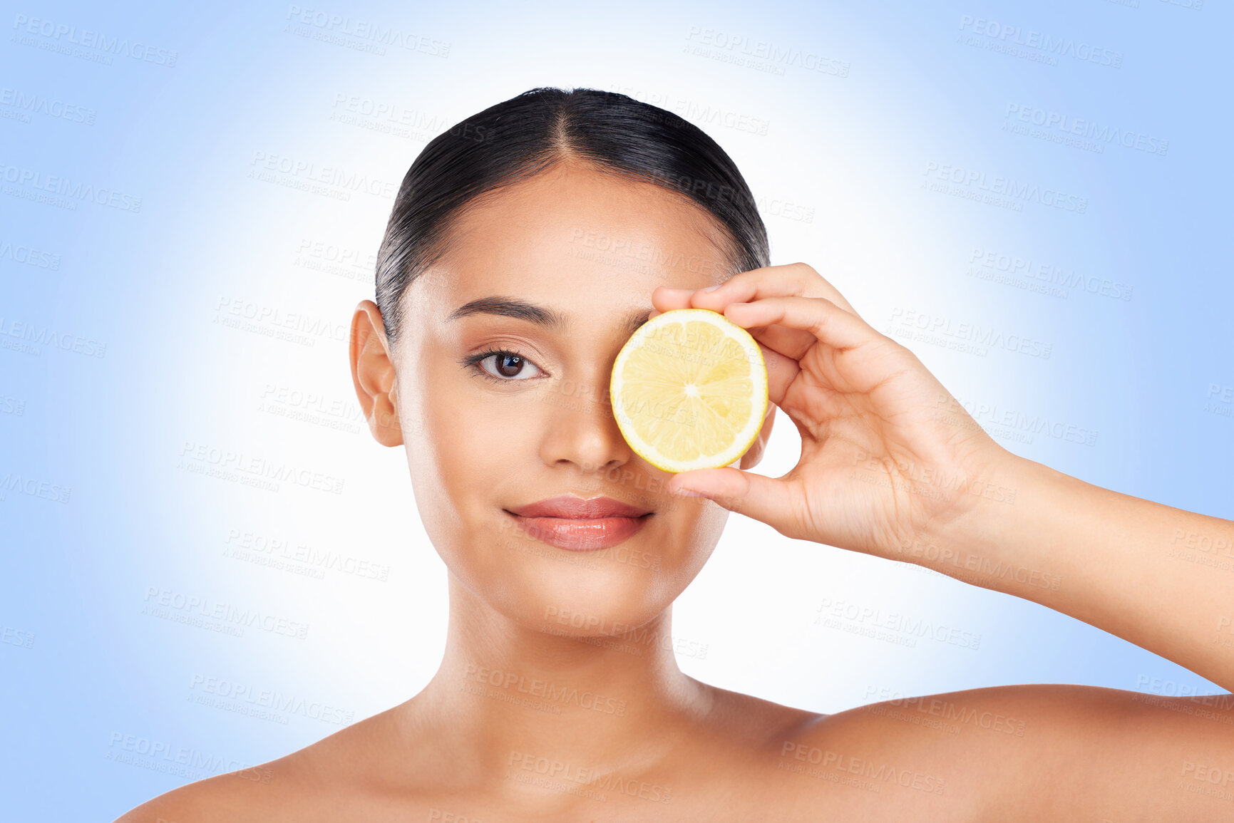 Buy stock photo Skincare, portrait and studio woman with lemon for organic anti aging treatment, natural self care routine or facial cosmetics. Vitamin C benefits, fruit or clean face of person on blue background