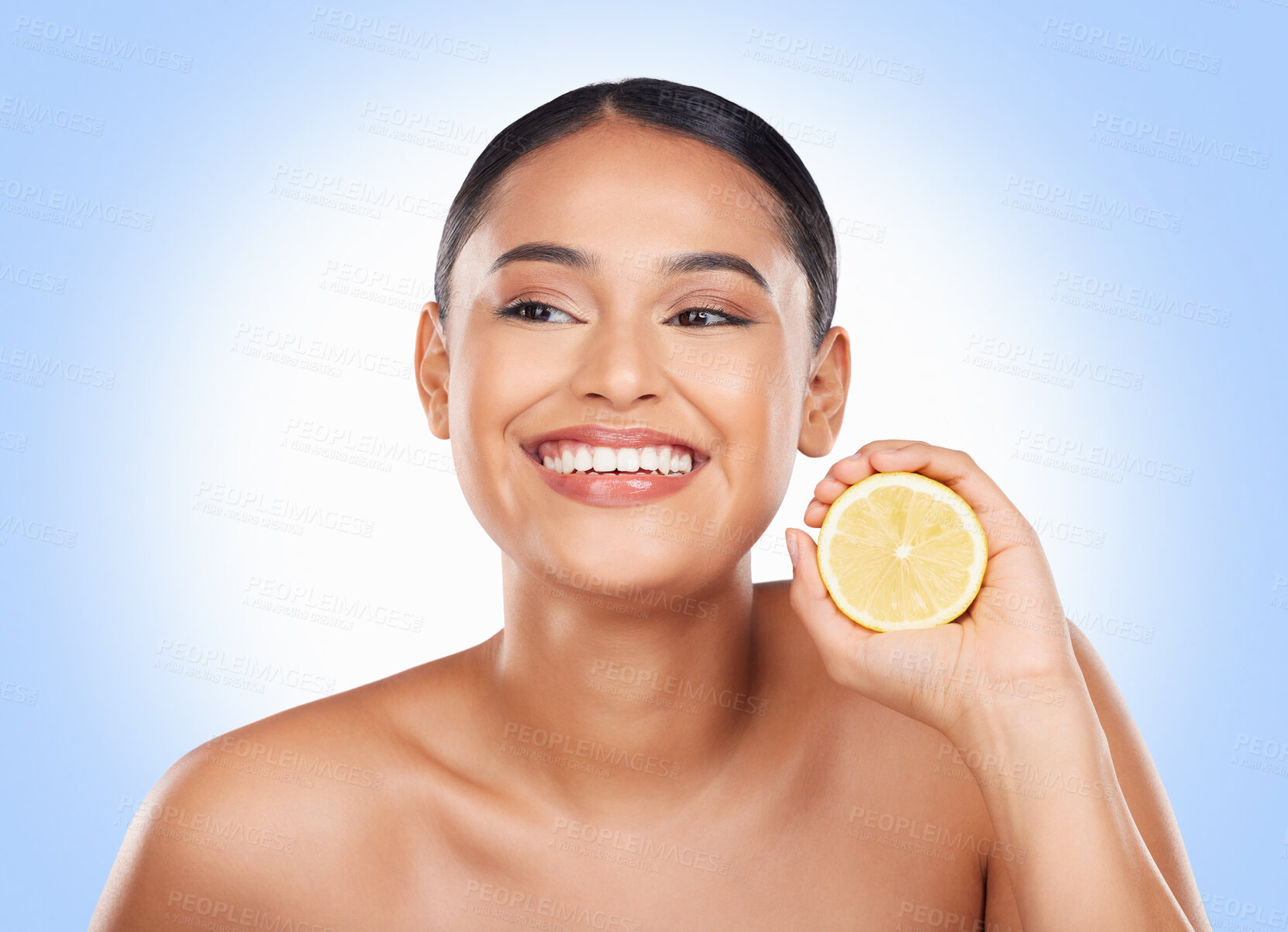 Buy stock photo Beauty, lemon and happy studio woman with citrus fruit for organic skincare glow, facial detox or natural cosmetics. Happiness, spa and clean self care model with vitamin C product on blue background