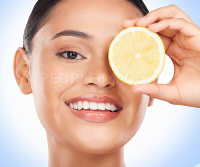 Buy stock photo Beauty skincare, portrait and happy woman with lemon for citrus detox treatment, natural self care or wellness. Vitamin C food, fruit product and studio face of dermatology person on blue background