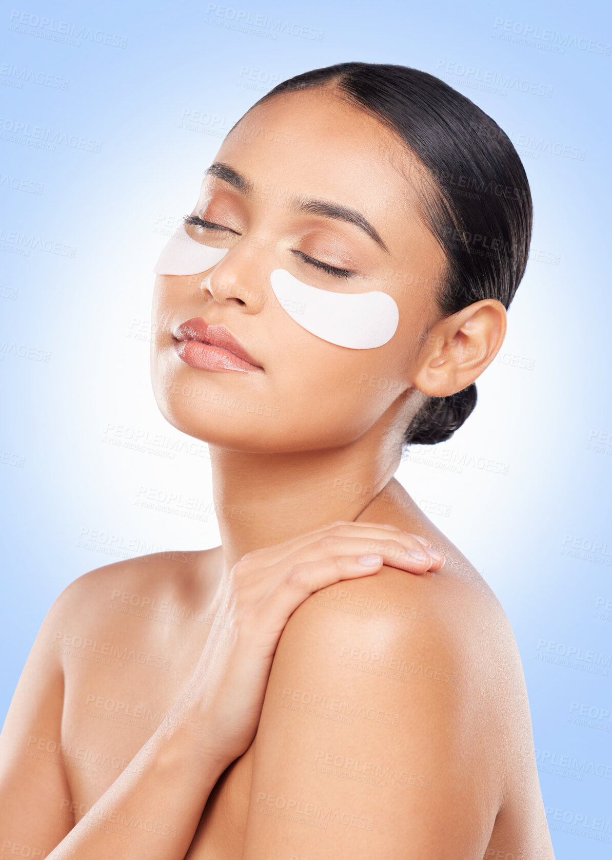 Buy stock photo Skincare, beauty and woman with collagen pads for anti aging or skin glow on blue background. Cosmetics, facial detox and face of model with luxury mask or eye product for dermatology pads in studio.