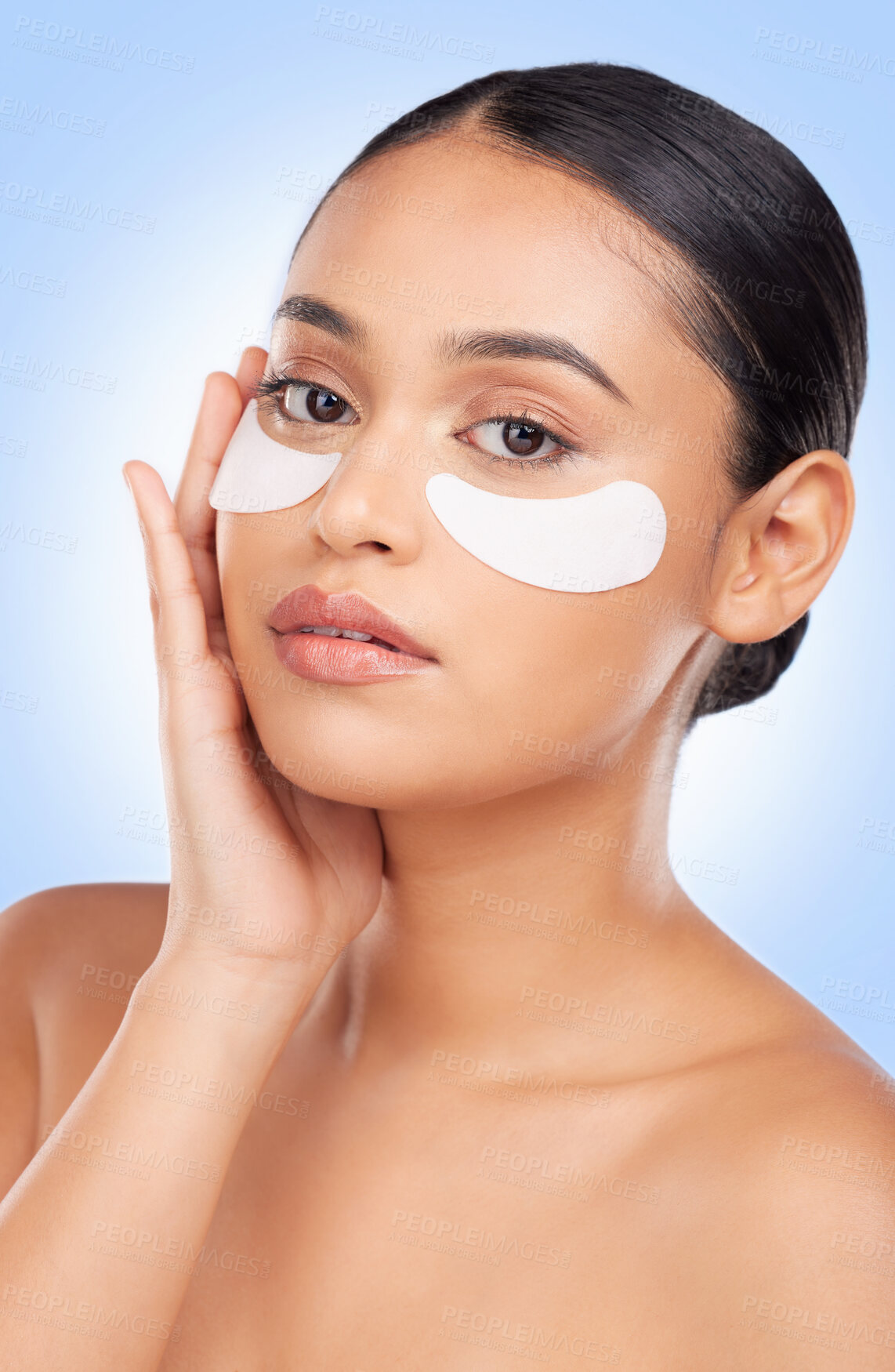 Buy stock photo Eye patch, skincare and woman with portrait and face health, dermatology and self care shine in studio on blue background. Beauty, person and facial product with collagen mask, wellness and glow 