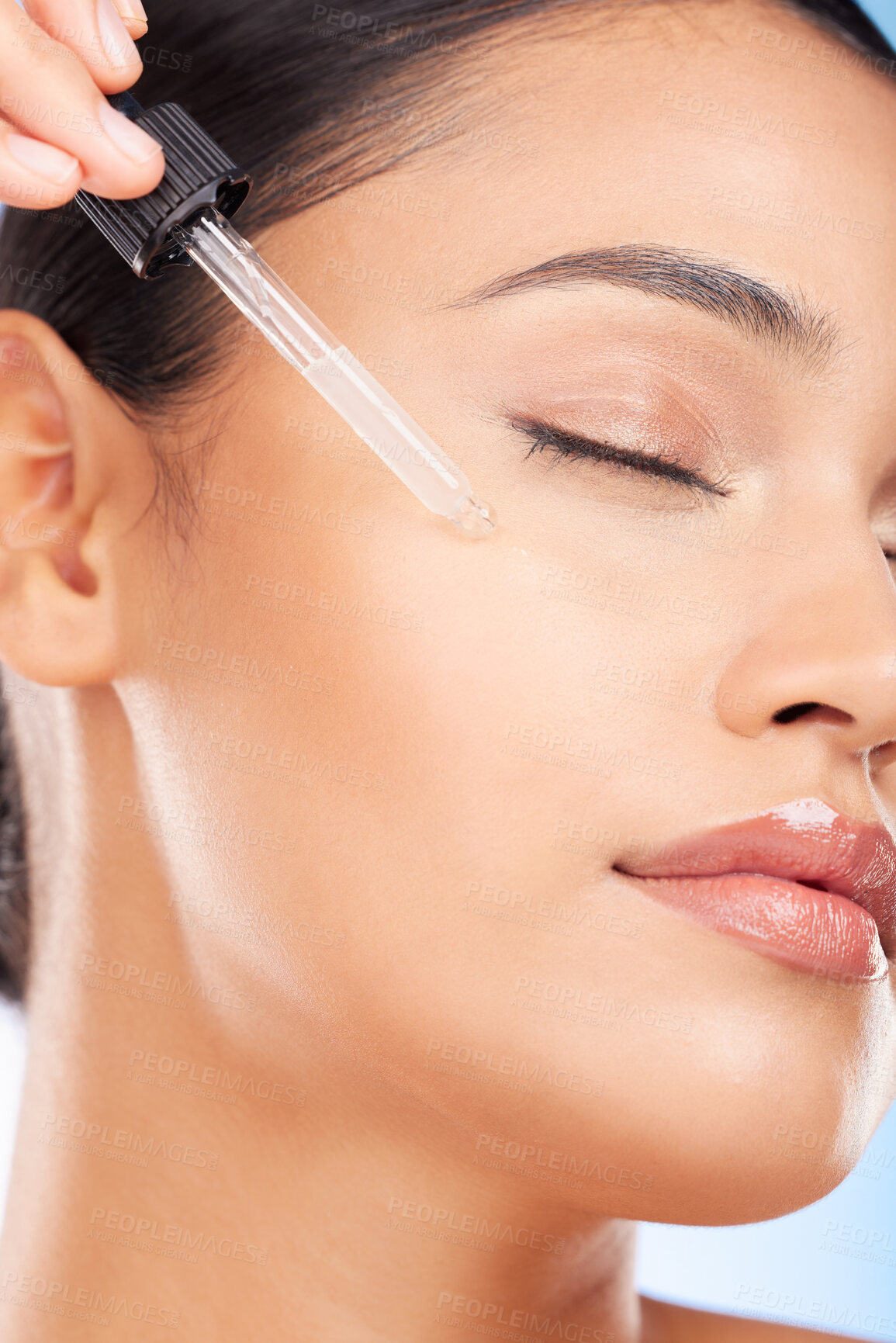 Buy stock photo Skincare, beauty and woman with serum in pipette for anti aging or skin glow on blue background. Cosmetics, facial detox and face of model with solution or collagen product for dermatology in studio.