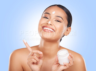 Buy stock photo Portrait, happy woman and jar of face cream in studio, advertising lotion and glowing skincare on blue background. Model, facial beauty and container of moisturizer, sunscreen or cosmetic dermatology