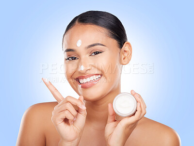 Buy stock photo Portrait, happy woman and jar of cream in studio for aesthetic, skincare or advertising product on blue background. Model, beauty and moisturizer container of sunscreen, dermatology or face cosmetics