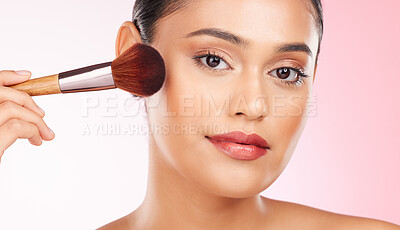 Buy stock photo Beauty, makeup and portrait of woman in studio with a brush for cheek blush or foundation for glam routine. Cosmetics, face and young female model with cosmetology product isolated by pink background