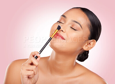 Buy stock photo Woman, makeup and brush nose in studio for beauty, skincare and face application on pink background. Happy model, dermatology and cosmetics tools for facial contour, powder and aesthetic foundation