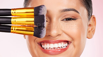 Buy stock photo Face makeup, brush or happy woman with studio cosmetics tools, anti aging glow and closeup facial transformation. Foundation application product, happiness or aesthetic model smile on pink background