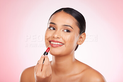 Buy stock photo Lipstick, mockup and face of happy woman with makeup or cosmetics on pink background space and thinking about product. Lips, beauty and model with ideas for skincare or choice of red color on mouth