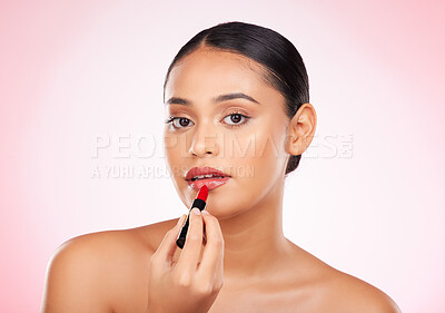 Buy stock photo Woman, red and lipstick with beauty and makeup, cosmetics product in portrait isolated on pink background. Cosmetology, apply bold color to lips and shine, wellness and transformation in a studio