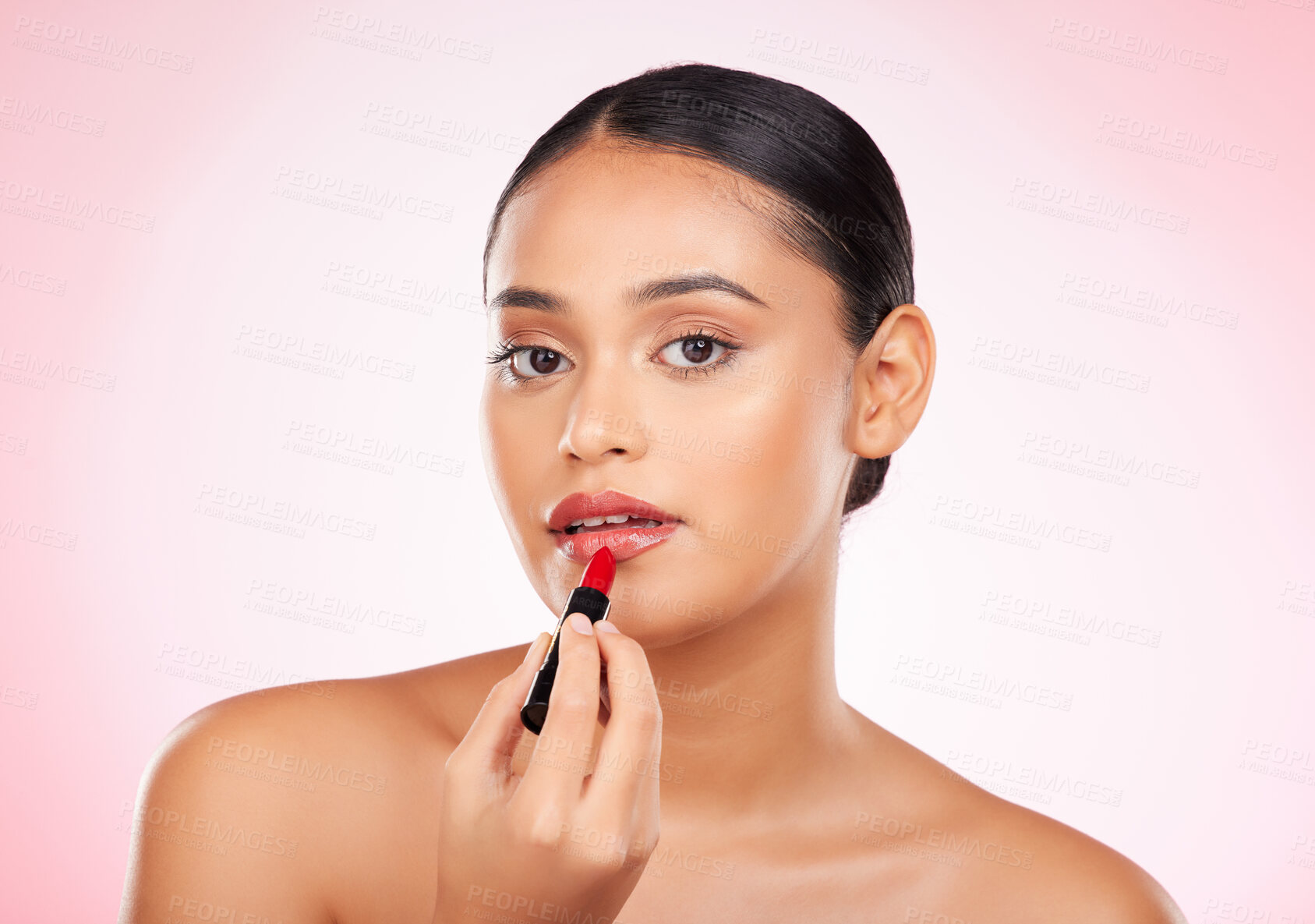 Buy stock photo Woman, red and lipstick with beauty and makeup, cosmetics product in portrait isolated on pink background. Cosmetology, apply bold color to lips and shine, wellness and transformation in a studio