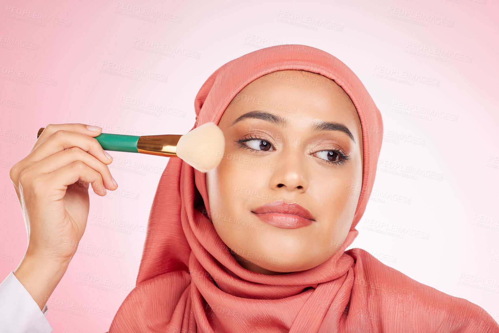 Buy stock photo Makeup, foundation brush and muslim woman with self care from cosmetics and blush in studio. Facial, glow and relax female person with beauty, skincare and shine with a hijab and skin tool for face