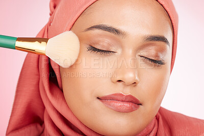 Buy stock photo Makeup, brush and muslim woman closeup with wellness from cosmetics and blush in studio. Facial, glow and happy female person with beauty, skincare and shine with a hijab and skin tool for face