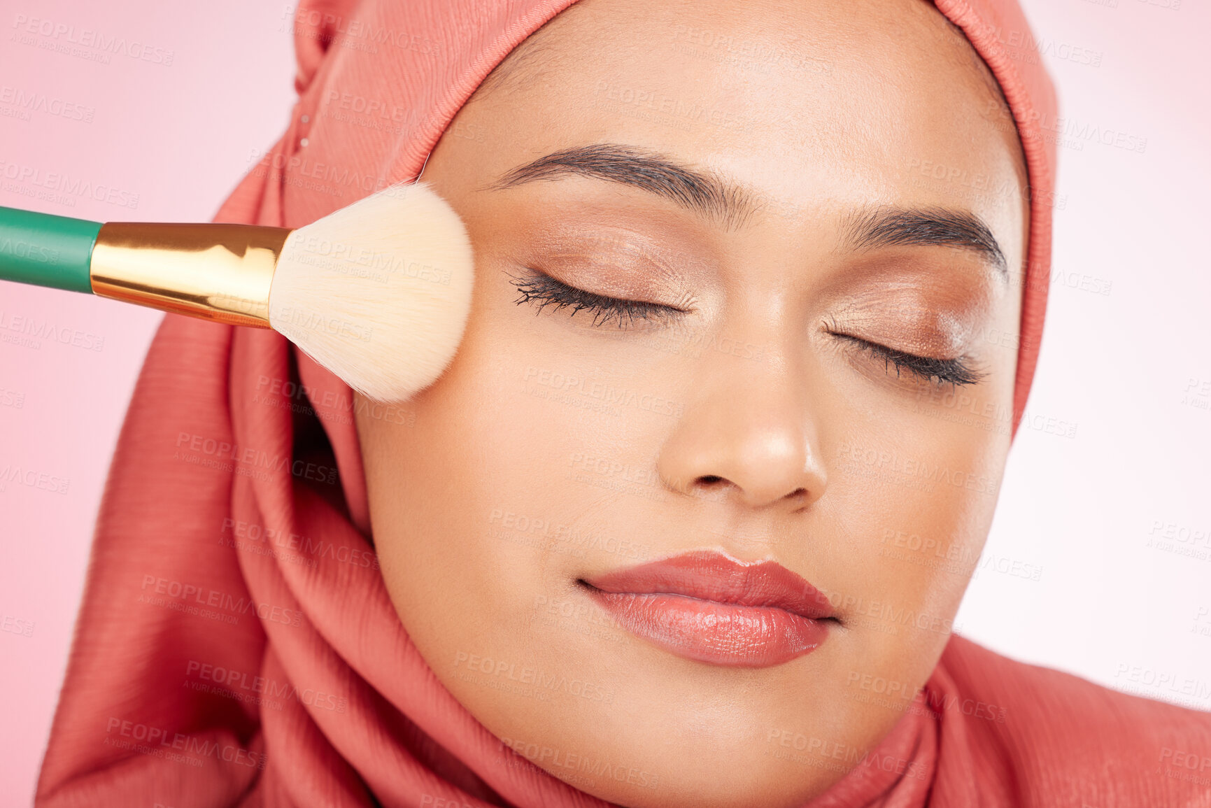 Buy stock photo Makeup, brush and muslim woman closeup with wellness from cosmetics and blush in studio. Facial, glow and happy female person with beauty, skincare and shine with a hijab and skin tool for face