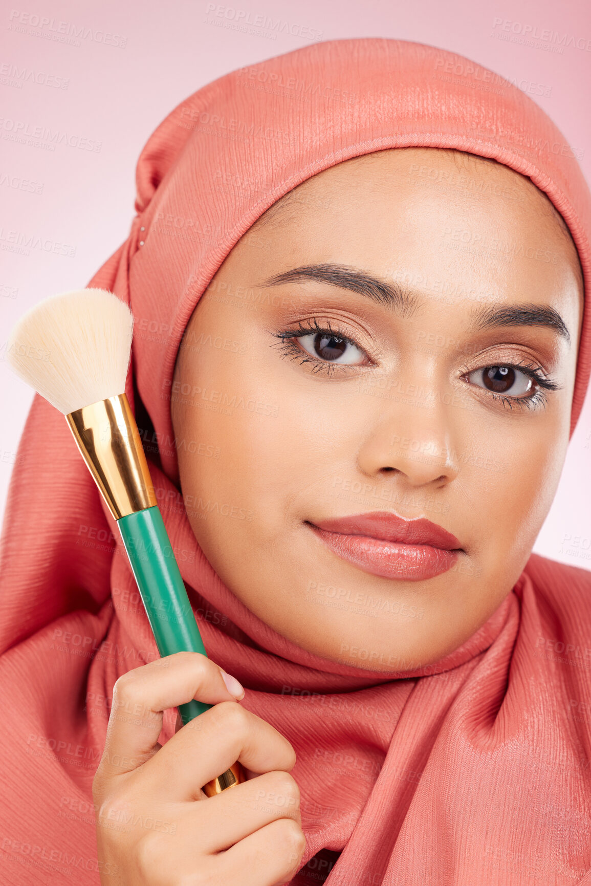 Buy stock photo Makeup, brush tool and muslim woman portrait with a smile from cosmetics and blush in studio. Facial, glow and happy female person with beauty, skincare and shine with a hijab and skin for face