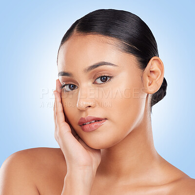 Buy stock photo Beauty, makeup and product with portrait of woman in studio for cosmetics, glow and self care. Health, skincare and dermatology with person on blue background for facial, salon and cosmetology