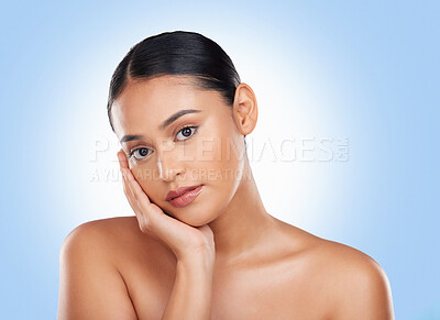 Buy stock photo Beauty, makeup and skincare with portrait of woman in studio for cosmetics, glow and self care. Health, spa and dermatology with face of person on blue background for natural facial and salon