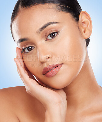 Buy stock photo Beauty, skincare and product with portrait of woman in studio for cosmetics, glow and self care. Health, makeup and dermatology with face of person on blue background for facial, salon or cosmetology