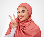 Peace sign, smile and muslim with portrait of woman in studio for support, kindness and motivation. Happy, emoji and wellness with face of person on white background for excited and v hand gesture